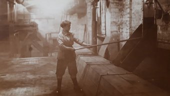 A woman performing heavy manual labor when women replaced men in the workforce during wartime in November 1917.