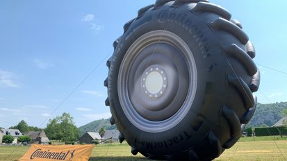 Continental advertises with giant inflatable agricultural tire along the Tour de France 2022
