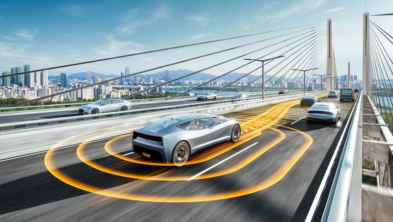 An autonomous driving car on a bridge with a modern city in the background.